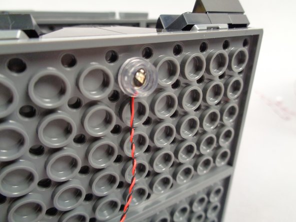 The plate and LED will have a tendency to pop out.  To solve this, you can pre-bend the LED wires, or you can un-twist them at the LED light base so the wires are flat (not twisted).