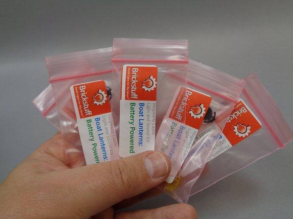 You will begin with the five boats.  You will need the five bags of boat lanterns, five sticky squares, and five batteries.