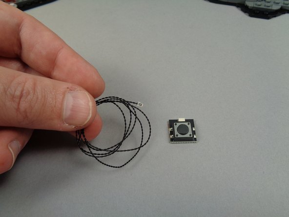 Now it's time to connect the large button that came with your light kit.  This button turns the moon on or off, and it also enables or disables the flickering and random lighting effects for the other lights.