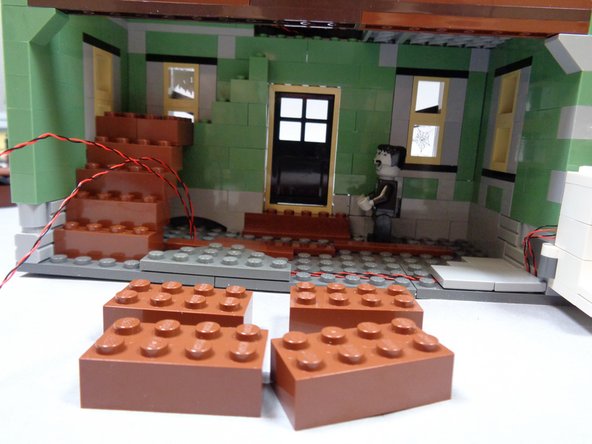 As shown in the third photo, remove the top four brown 2x4 bricks that make up the staircase.