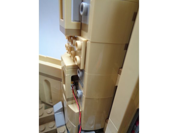 It may help to use a pair of tweezers to insert the lights.