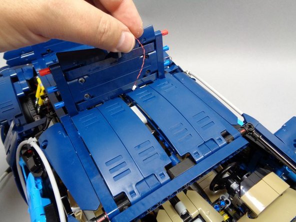 As shown in the second photo, run the Pico LED cable back under the top of the roof to the area where all the wires and controller board are located.