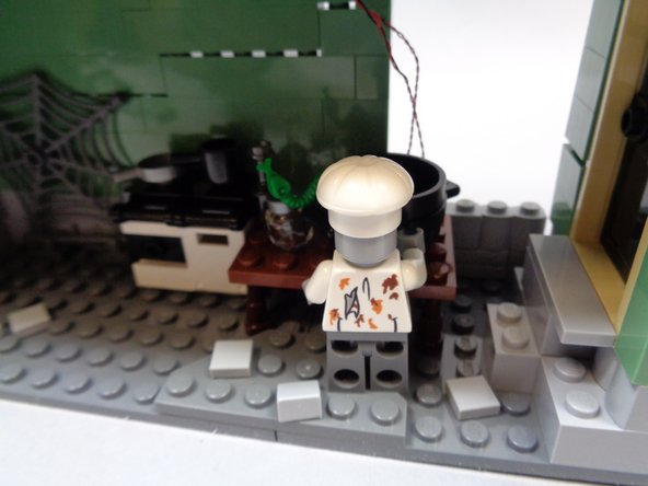 Replace the table and chef as shown in the third photo.