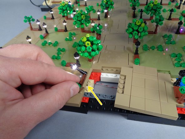 Next you will re-attach the small plate between Panels 2R and 3R (this is the plate you removed earlier to run the control cable).