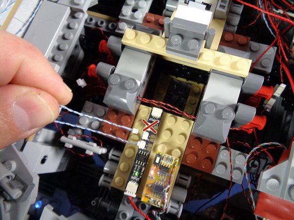 As shown in the photos for this step, connect the other ends of the two conversion cables  to the bottom two plugs on the BRANCH09 adapter board.
