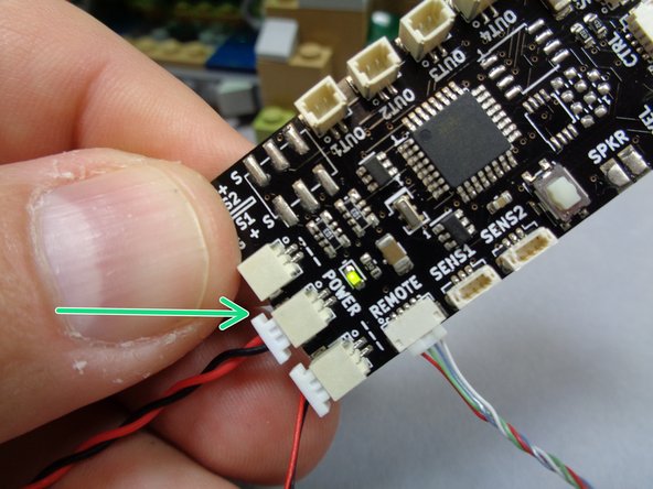 Take the USB power cable from your kit and connect the power wire to the TRUNK08 main control board as shown by the green arrow in the third photo.