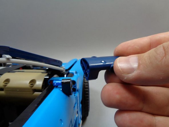 In this step, you will route the LEFT headlight wire and the THREE-WIRE cable (with red/black/white wires).