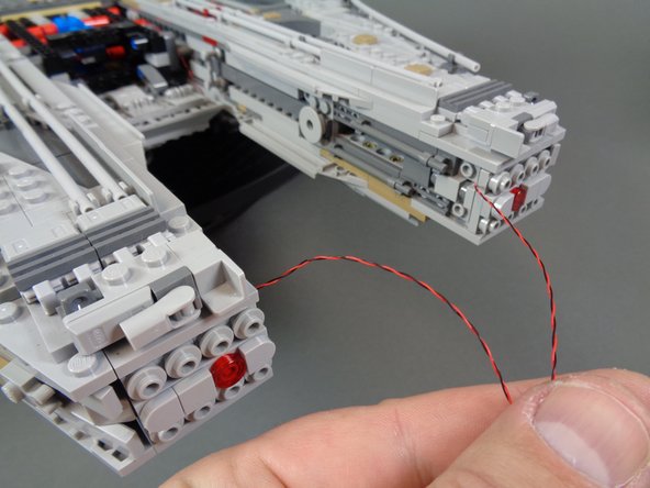 As shown in the first photo, re-attach the two front mandibles.