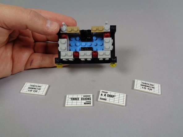 As shown in the photos for this step, begin disassembling your marquee bottom section.