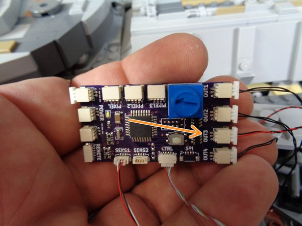 The second and third photos show the two different styles of TRUNK08 controller that may be included with your kit.  Refer to the photo that matches the TRUNK08 design included with your kit.
