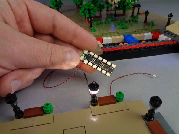 As shown in the final photo for this step, connect each of the four lamp posts to the BRANCH12X driver board to make sure each lights up.  Troubleshoot as needed if less than four lamp posts light up.