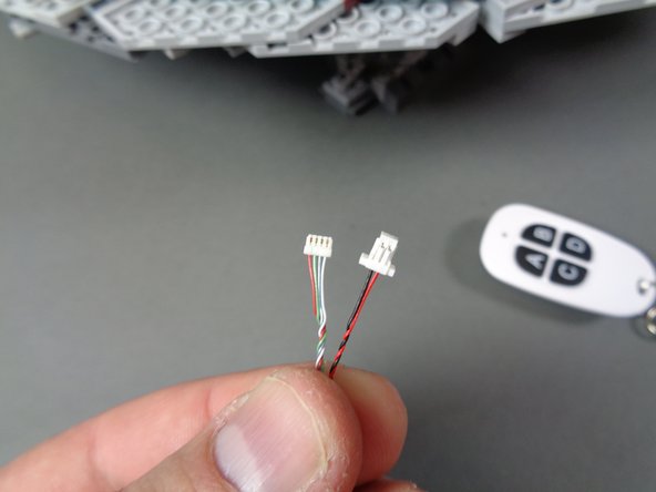 In this step, you will connect the remote receiver to the TRUNK08 master controller.