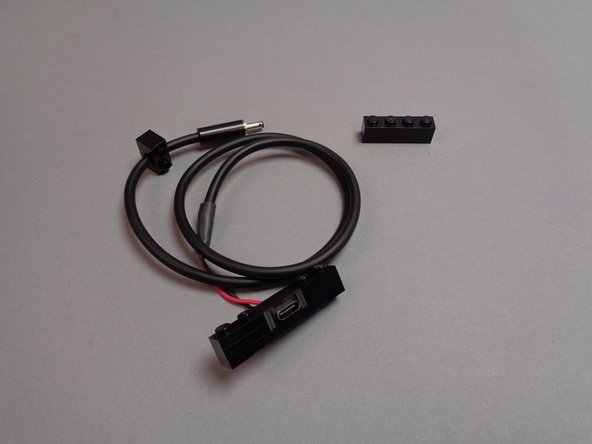 The first photo for this step shows the parts included in the USB-C power connector bag.