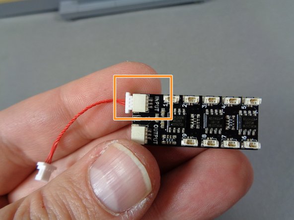 Remove the BRANCH09X adapter and the 1.5&quot;/3.8cm red wire from the &quot;Lower Level Lights and Parts&quot; bag.