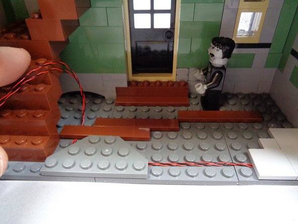 As shown in the third photo, remove the top four brown 2x4 bricks that make up the staircase.