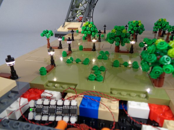 As shown in the second photo for this step, all eight lamp posts should light up.