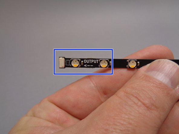 The yellow arrow in the first photo and the yellow box in the second photo show the INPUT connector for the strips.