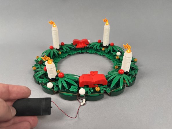 As shown in the second photo, connect the plug from the battery pack to any of the remaining open connectors on the BRANCH20 adapter board.