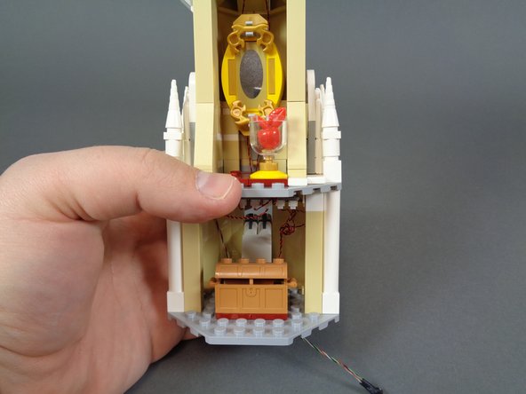 Because you are attaching the jumper plates one stud forward from the back wall, you will have two extra jumpers as shown in the first photo.  You can set these aside.