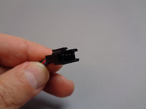The inter-level connecting board has different plugs on each end.  The first photo in this step shows the male plug, which is large and has a latching clip on top.