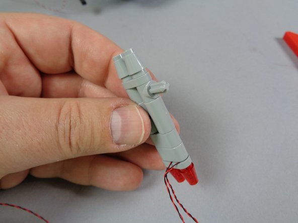 As shown in the photos for this step, re-assemble the tail light assembly.