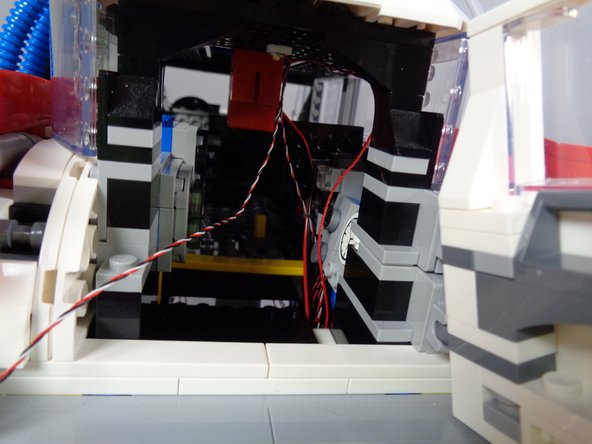 Finally, you will route both of the lightbar control wires down through the same opening as the other wires.