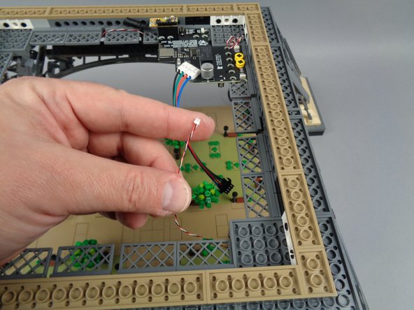 Now that you have mounted all eight light strips and connected each pair in a loop starting at the "LOOP BEGIN" plug on the main controller, you will now complete the control loop using the last control cable.