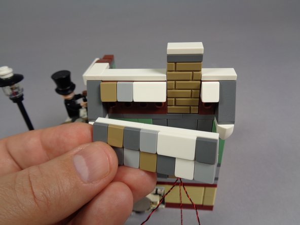 When you are finished, the back of your model should look like the third photo, with five light wires passing toward the battery pack.