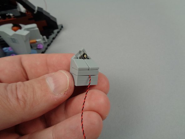 Make sure to leave a little extra wire so the wires don't get pinched when you re-attach the plate and slopes.