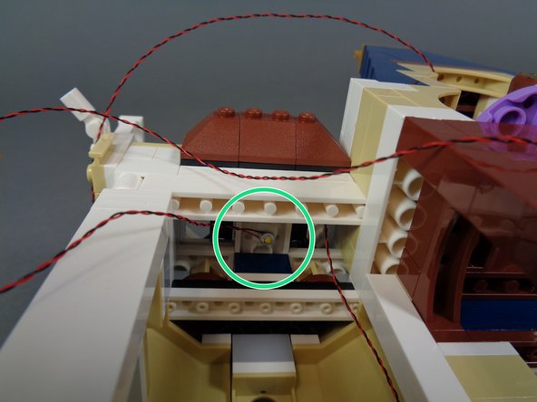 As shown by the green circle in the second photo, stick the warm white Pico LED light to the ceiling of the spinning room.