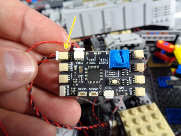 The photo shows the power wire connected to the top plug on the TRUNK08, but you can use any of the three POWER plugs.