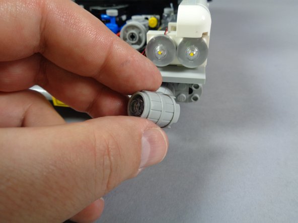 Next you will begin preparing the four lower headlights.  Repeat the steps shown to mount lights inside all four of the lower headlights.