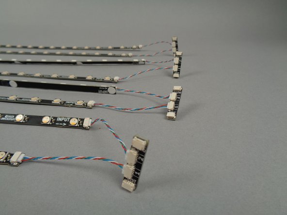 As shown by the green arrows in the first photo, make sure you are connecting the ends of the 17-LED strips labeled INPUT to the adapter boards.