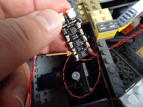 As shown by the orange arrow in the second photo, carefully connect the plug from the cockpit interior light wire to plug #7 on the second BRANCH09X adapter board.