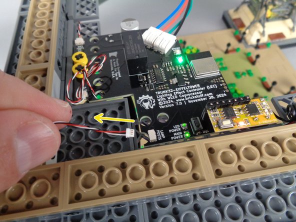 As shown by the yellow arrow in the first photo for this step, carefully disconnect the 3-wire control cable from the &quot;LAMP POSTS&quot; plug on the main controller.
