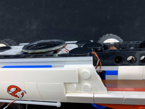 Make sure the speaker is centered on the bottom of the car.