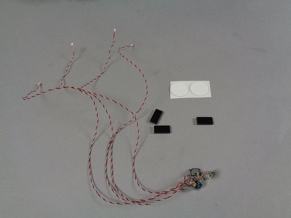 Take the small pink bag labeled &quot;DOOR SWITCHES&quot; from the &quot;MAIN CHASSIS PARTS&quot; bag, and empty its contents.