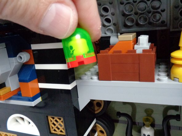 As shown in the photos for this step, remove the skull jar assembly from the attic, and separate the pieces.