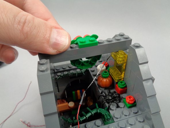 As shown in the first photo for this step, replace the first attic cross-beam.