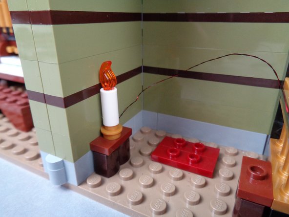 Although not shown in these photos, you should remove the obelisk from the room before re-attaching the candles.