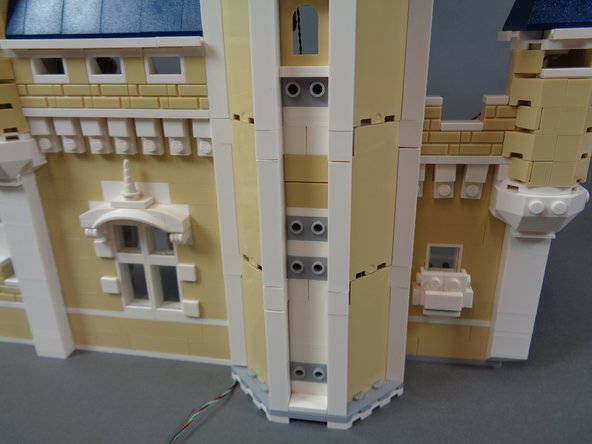 Finish re-assembling the castle front as shown in the photos for this step.