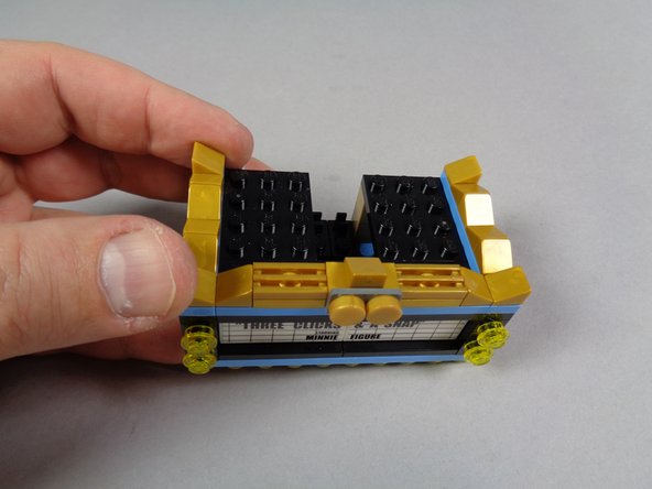 As shown in the photos for this step, begin disassembling your marquee bottom section.