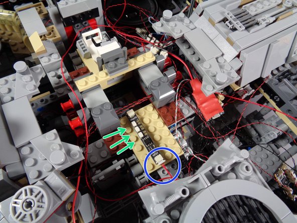 As shown in the third photo, mount the BRANCH09 adapter board to the tan plate just behind the center of the Falcon.