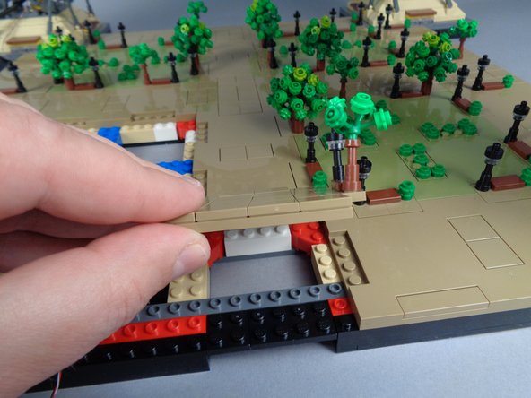 As shown in the first and second photos for this step, remove the small panel between Sections 2 and 3 (this is the small panel next to Panel 2R).