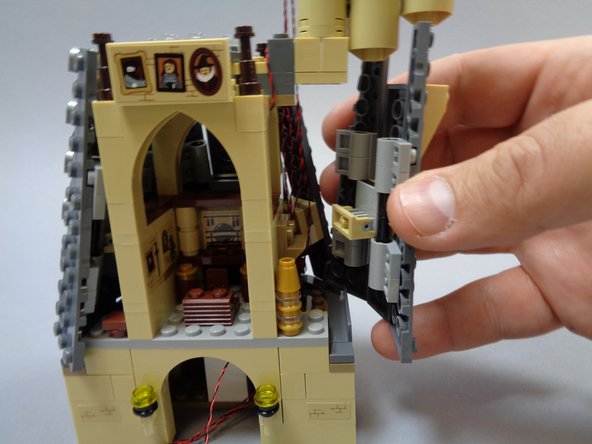 Re-attach the three small rooftop towers.