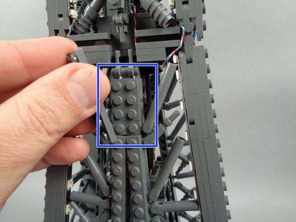 As shown in the second photo, re-position any brace elements as needed to make room for LED lights.