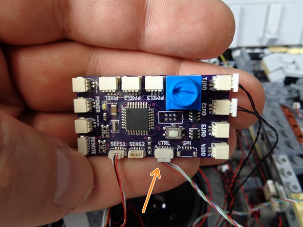 Both designs of TRUNK08 master controller are shown in the photos.  Refer to the photo that matches the specific controller included with your kit.