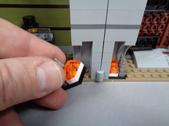 Next you will mount a flickering LED light assembly in the second half of the fireplace the same way you did with the first half.