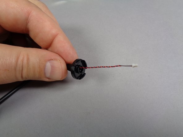 As shown in the second photo, carefully feed the LED light plug and wire through the center of the base, and re-attach to the lamp post pole as shown in the third photo.