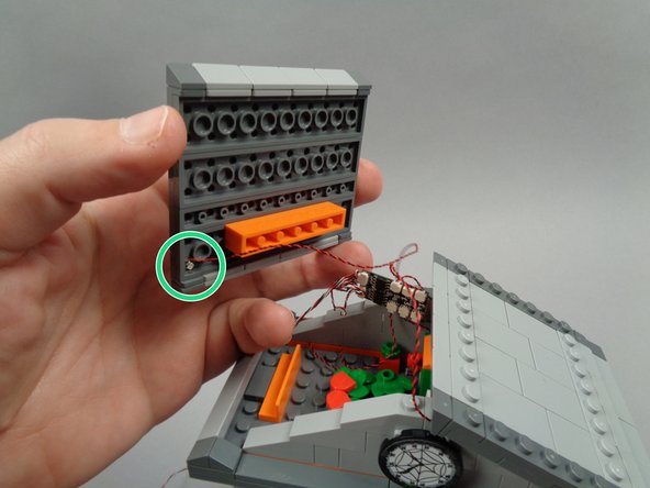 Re-attach the second roof section.  Make sure you have the section positioned as shown by the green circle in the second photo, with the roof LED Light facing toward the front of the town hall.